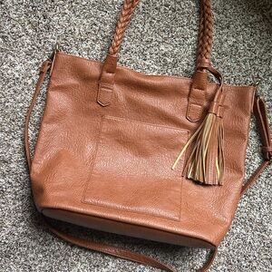 Faux leather brown tote w/braided shoulder straps and cross body strap. Tassel.